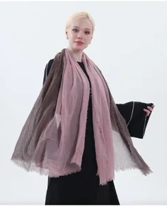 Close-up detail view of the elegant gradient cotton linen scarf in soft tones.