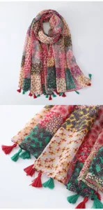 Colorful floral printed tassel scarf with bohemian style patchwork design, detailed fabric view.