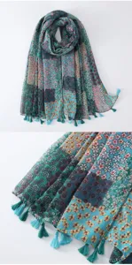 Detailed view of the bohemian floral print tassel scarf showcasing fabric texture and details.