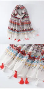 Bohemian style colorful printed scarf detail, featuring geometric patterns and delicate tassels.