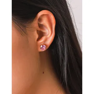 Close-up detail of minimalist pink zircon ear studs featuring durable stainless steel gold finish.