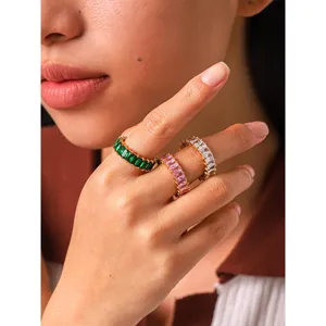 Detailed close-up view of colorful baguette cubic zirconia titanium steel stackable rings.