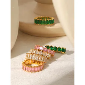 Close-up detail of luxury colorful zircon rings, sparkling baguette and round gemstone band.