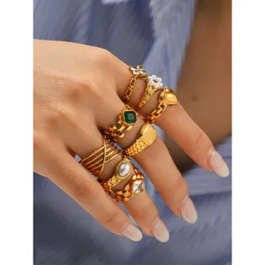 Gold stainless steel stackable rings set, trendy watch band design with pearls and gems.