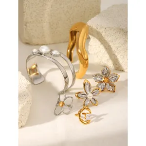 Gold and silver two-tone stainless steel floral rings and bracelets, light luxury jewelry for women.