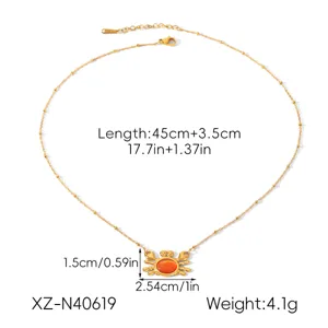 Gold stainless steel crab pendant necklace with adjustable length and elegant design.