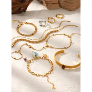 Stainless steel 18k gold plated jewelry set with zircon bracelets and cute heart pendant rings.