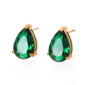 Detailed close-up of elegant pear-cut green zircon stud earrings with gold steel.