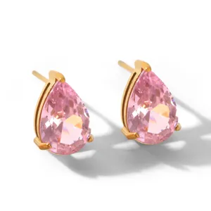Pear-cut pink zirconia stud earrings closeup detail, elegant gold plated jewelry design.