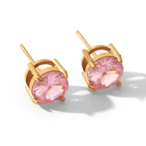 Detail view of minimalist round pink zircon gold stud earrings, elegant daily jewelry style.