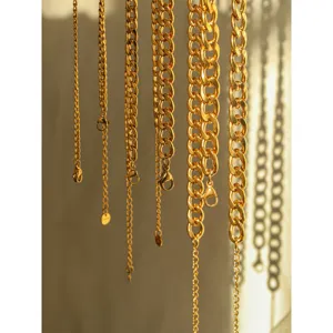 Gold stainless steel Cuban chains necklace detail view, stylish metal link jewelry for women.