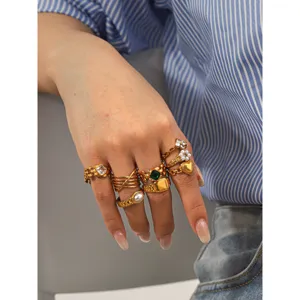 Trendy stainless steel gold multi-ring set for women watch strap ring jewelry accessory.