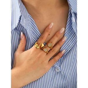 Stainless steel geometric ring set featuring irregular design, heart pave and round diamond accents.