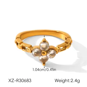 Gold stainless steel ring detail shot featuring sparkling zirconia stones and delicate design.