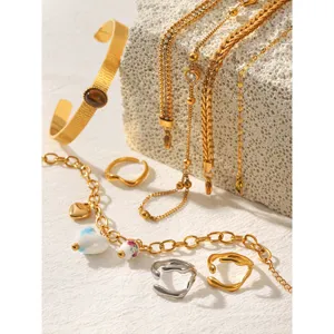 Elegant 18k gold plated stainless steel jewelry set featuring chic zircon bracelets and rings.