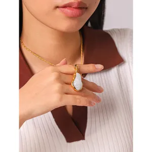 Gold stainless steel pendant necklace, elegant irregular shape clavicle chain jewelry detail.