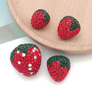 Rhinestone strawberry clay charm DIY jewelry pendant necklace accessory detail view.