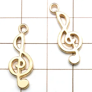 Gold treble clef charm pendant detail view, perfect for DIY handmade jewelry crafting.