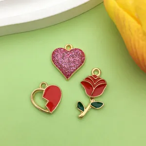 Enamel rose and glitter heart alloy DIY jewelry pendant charms detail close up shot.