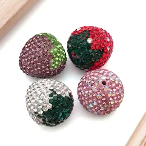 Rhinestone studded clay strawberry beads for DIY charm bracelets and necklace jewelry making accessories.