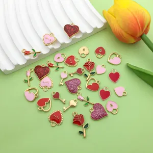 Close-up detail of mixed enamel heart and rose alloy DIY charms, colorful jewelry making accessories.