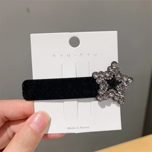 Black velvet hair clip with rhinestone star detail, elegant side hairpin for women and girls.