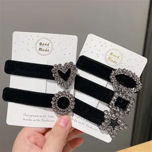 Black velvet hair clips with sparkling rhinestones, elegant handmade design for women and girls.
