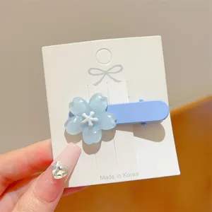 Jelly resin blue flower hair clip detail shot, sweet floral duckbill side hair accessory.