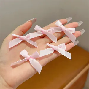 Cute pink satin bow hair clips for sweet girls, perfect for daily wear and ballet style.