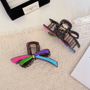Pince à cheveux nœud colorée pour femme, pince requin style dopamine chic et tendance.