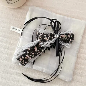 Floral bow hair claw clip with black ribbons and delicate lace trim for half-up hairstyles.