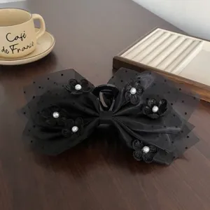 Pince a cheveux noire en tulle a pois et perles en forme de fleur grand modele detail chic