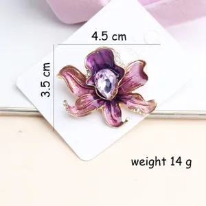 Purple enamel flower brooch detail, elegant rhinestone orchid design for women coats and dress.