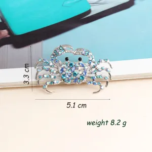 Exquisite blue rhinestone crab brooch detail shot, alloy crystal animal pin fashion accessory.