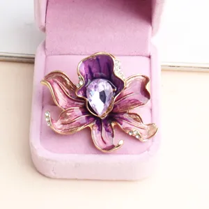Elegant purple enamel flower brooch with center crystal rhinestone for women coats and dress.