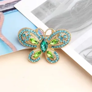 Exquisite butterfly rhinestone brooch, gold tone with blue and green crystal fashion jewelry.
