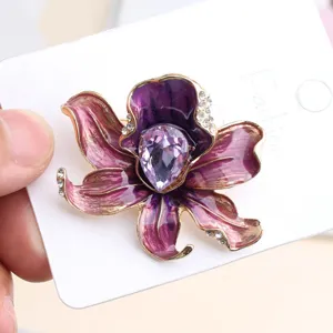 Elegant purple enamel flower brooch with crystal and teardrop rhinestone for women.