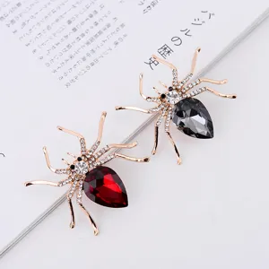 Prachtige strass spin broche set met rode en grijze kristallen druppels, gouden metaal.