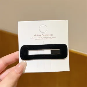 Korean style black velvet hair clip detail shot, elegant rectangular side clip for bangs and styling.
