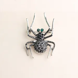 Exquise broche araignée noire avec strass verts bijoux de mode en alliage unique pour femmes