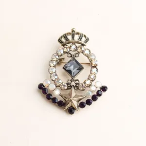 Vintage crown star crystal brooch detail shot, baroque retro alloy fashion jewelry for women.