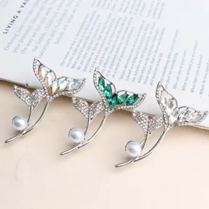 Elegant crystal pearl mermaid tail brooch set, versatile sparkling fashion pin for women.