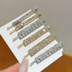 Exquisite rhinestone bobby pins set featuring sparkling crystal stones on dual-color metal clips.