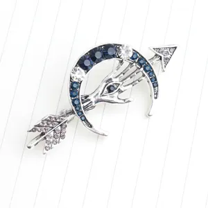 Vintage silver crescent moon arrow palm eye brooch with blue clear rhinestones lapel pin.
