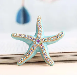 Turquoise enamel starfish brooch with colorful rhinestones, marine beach vacation jewelry item.