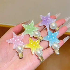 Detail view of colorful gradient starfish pearl hair clips, sweet side hair pins.