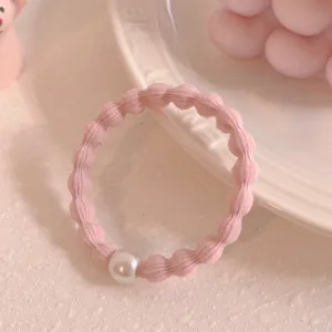 Pink bean texture hair tie with pearl charm, sweet and simple elastic ponytail holder for daily wear.