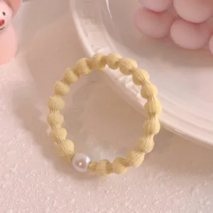 Cute yellow bean hair tie with white pearl charm elastic ponytail holder for daily styling.