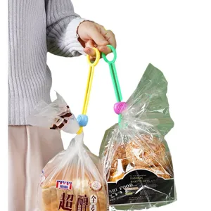 Colorful plastic snack bag sealing clips with pull ring for kitchen food freshness storage.