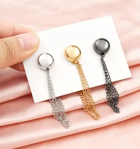 Close up of magnetic pants hem cinching clips with metal chains in three assorted colors